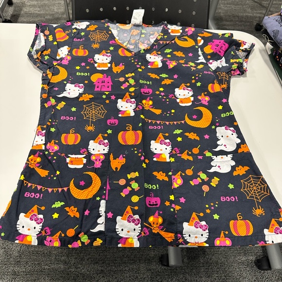Ladies size xs (3) and small (4) Halloween scrub tops. - Picture 14 of 15